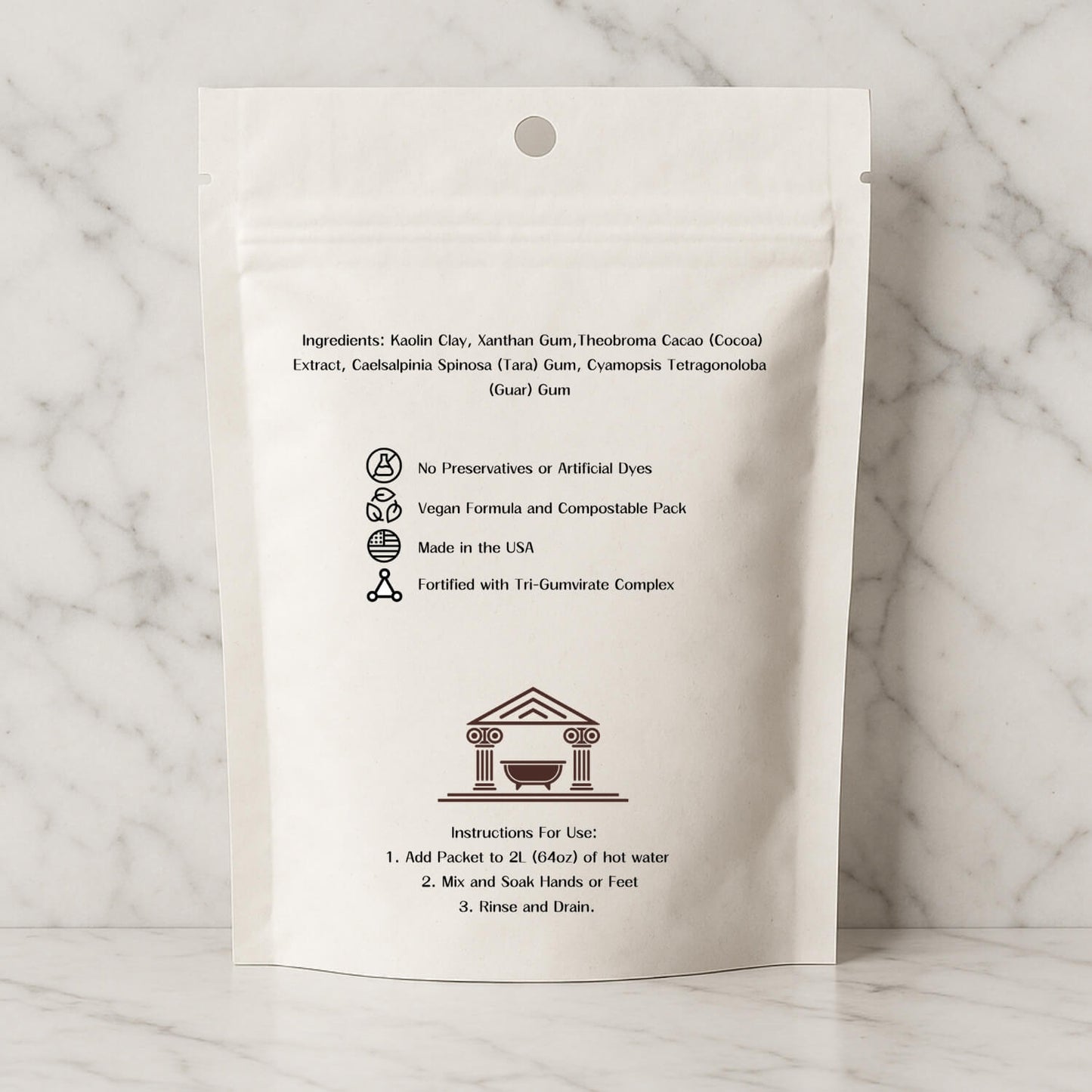 Aquae Terra premium at home mud bath back packaging on a marble background