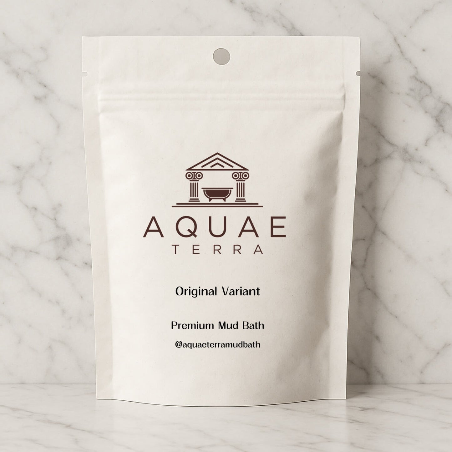 Aquae Terra premium at home mud bath front packaging on a marble background